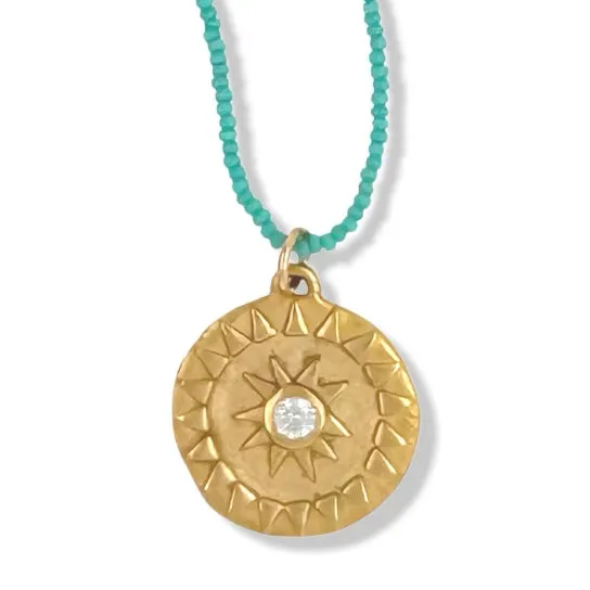 LARGE SOL NECKLACE IN GOLD ON TURQUOISE BEADS