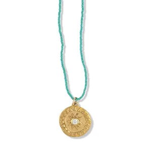 LARGE SOL NECKLACE IN GOLD ON TURQUOISE BEADS